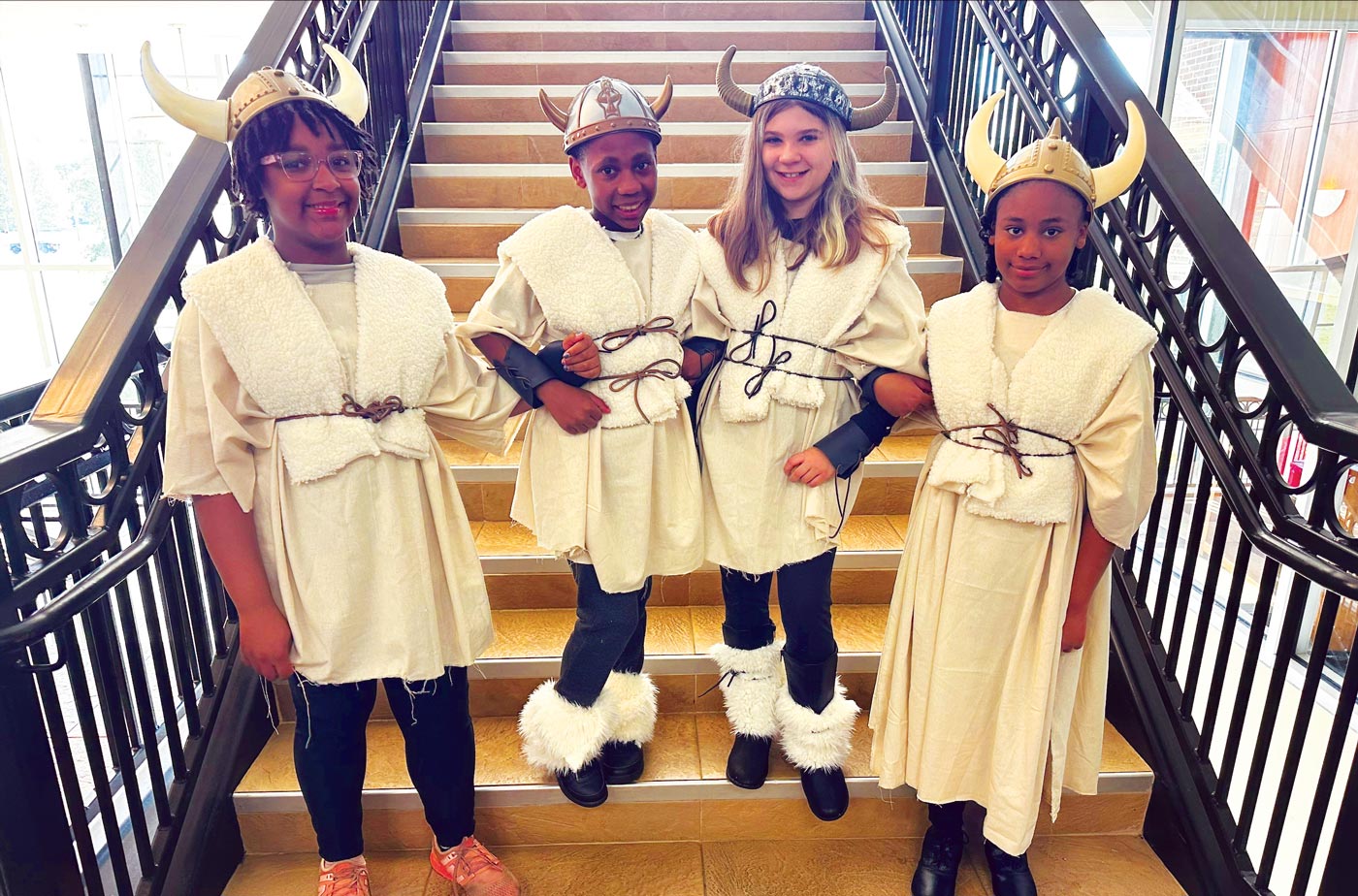 three students dressed as vikings